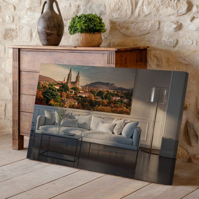 Canvas A Serene Interior Scene Featuring A Cozy Living Room With Wall Art A White Plush Sofa Adorned With Soft Light Colored Pillows Canvas Wall Art