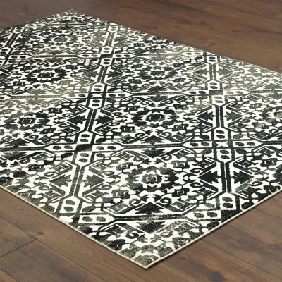 Tapis bleu marine / ivoire en polypropylène tissé à la machine Leonel
