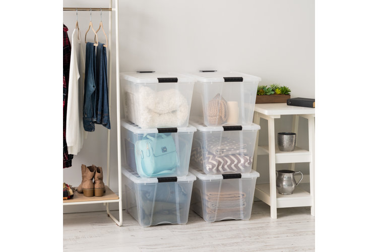 collection of clear totes with clothing inside