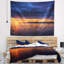 Tapisserie bord de mer bleu ciel nuageux et soleil couchant-28491889