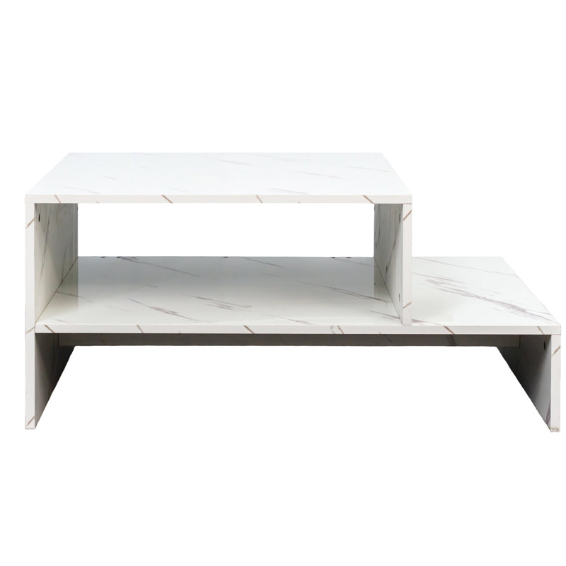 Table basse blanche avec magnifique forme architecturale et espace de rangement à couper le souffle