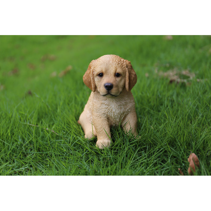 Statue retriever chiot assis
