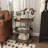 Lakinya Wood Rolling Oval 3 Shelf Brown Bar Cart with Black Metal Frame