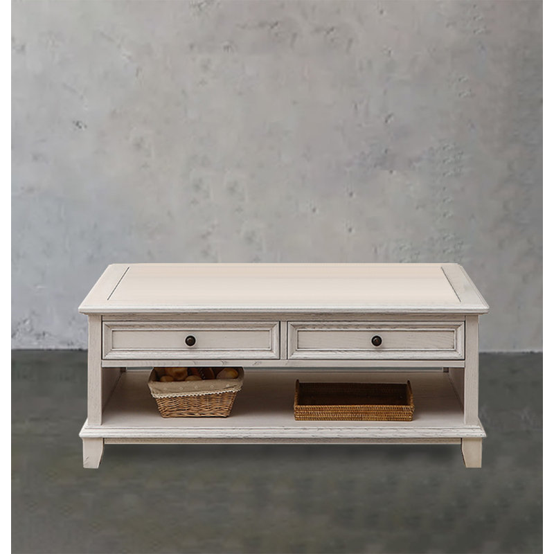 Four-drawer coffee table in solid white wood., 20.08" H x 49.21" L x 27.95" W