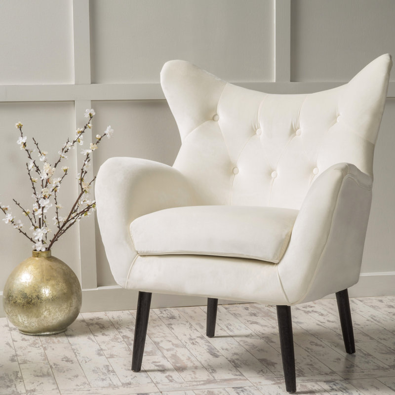 Chaise en velours avec accoudoirs évasés et fabrication solide