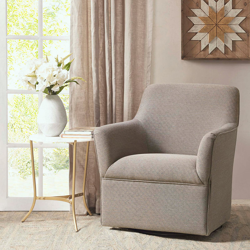 Fauteuil oscillant pivotant avec accoudoirs évasés et coussin serré