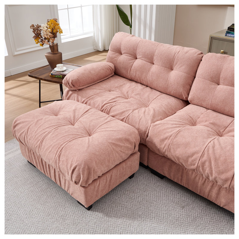 Canapé modulaire rose avec assise profonde et structure en bois