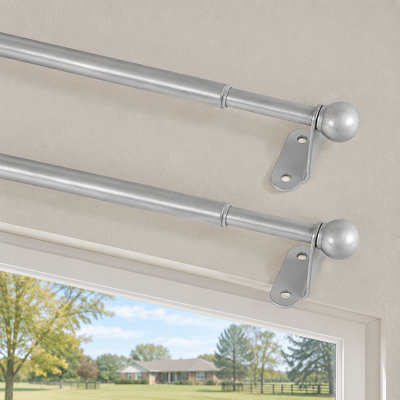 Nickel adjustable cafe curtain rod for windows and French doors spans 18-30 Inch with a 1/2" diameter and installs using screws with brackets.