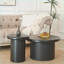 Table basse moderne double ronde noire avec pieds cannelés, peu encombrante pour le salon