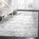 Riebe Abstract Ivory/Silver Area Rug