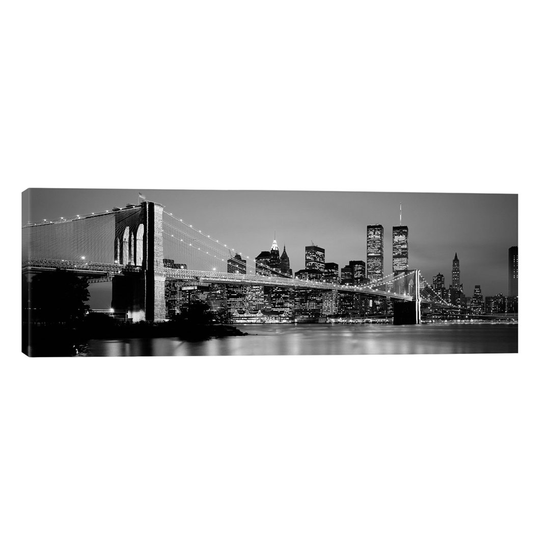 Illuminated Brooklyn Bridge With Lower Manhattan's Financial District Skyline In The Background In B&W, New York City, New York by Panoramic Images -