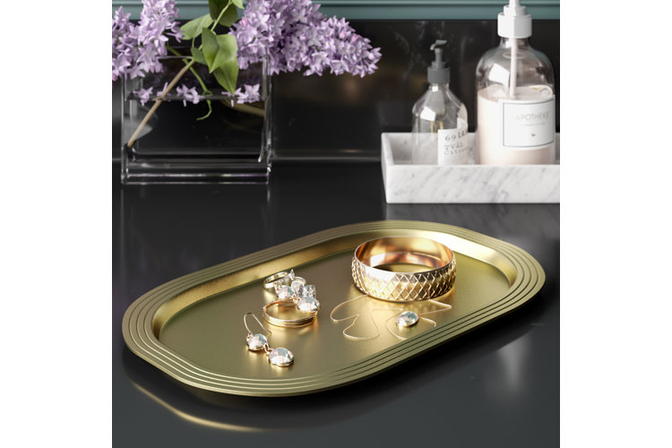 gold metal tray with jewelry