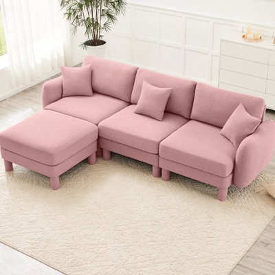 Canapé modulaire en L à 3 places en tissu rose avec des pieds cylindriques distinctifs et un revêtement respirant pour les coussins décoratifs élégants