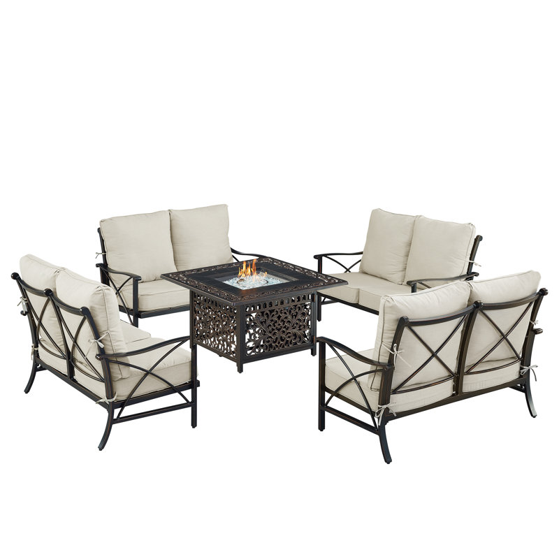 Ensemble de table de foyer en aluminium noir avec quatre causeuses profondes