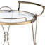 Chariot de service Prominent Champagne, 2 compartiments ouverts pour le rangement, tablette en verre trempé transparent, base en miroir de 5 mm, cadre et poignée en métal, roulettes multiples, modèle rond à finition multiple, rangement