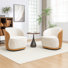 Fauteuil demi-tonneau pivotant en velours Stith