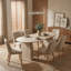Table de salle à manger moderne extensible en bois ovale avec base à deux piliers, conception peu encombrante pour une utilisation polyvalente dans le salon ou la salle à manger