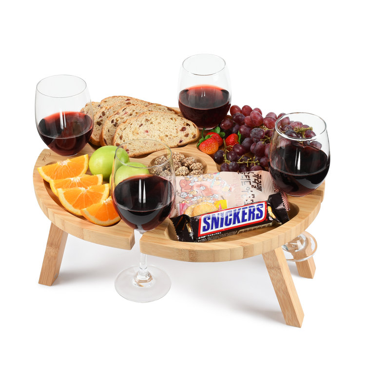 https://assets.wfcdn.com/im/80752843/resize-h755-w755%5Ecompr-r85/1993/199389654/Portable+Picnic+Table+with+4+Wine+Glasses+Holder%2C+Functional+Bamboo+Snack+Tray+Table+-Foldable+for+Party%2C+Picnic%2C+Camping%2C+Beach+%2815.7%22+x+12.5%22%29.jpg