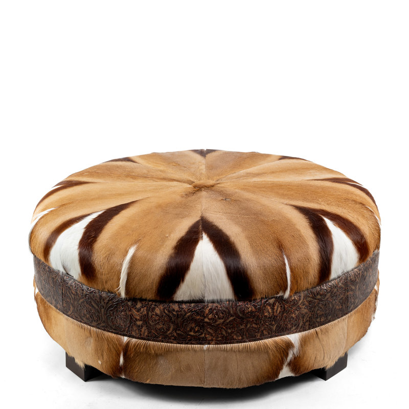 Table basse ronde en cuir de vache avec repose-pieds capitonné