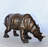 Ilmars Relaxed Rhino bronze statue -  Size: 16"L x 9"W x 8"H.