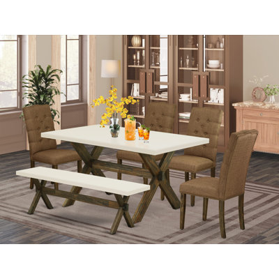 L'ensemble de salle à manger 6 pièces contient une table de salle à manger rectangulaire avec des pieds en X et 4 chaises rembourrées en tissu de lin brun avec un banc, finition jacobine patinée