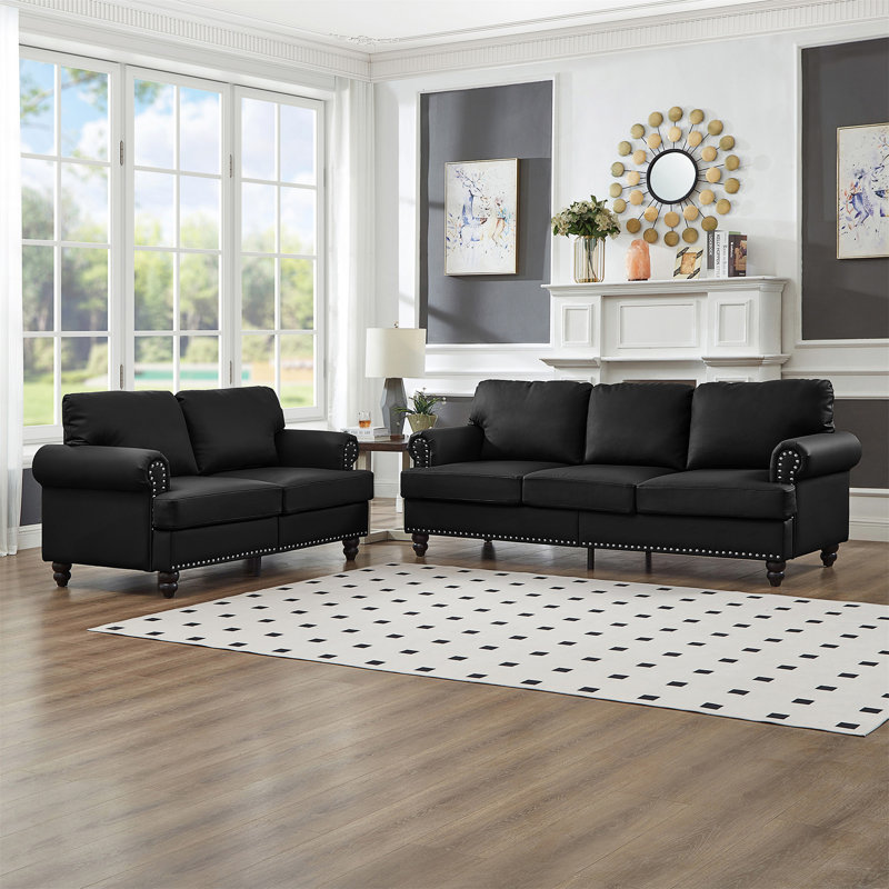 Causeuse et canapé 2 + 3 places Modern Classic avec garniture cloutée, structure en bois massif et housses de coussin amovibles.