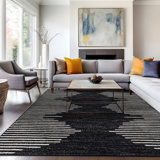 Malica Geometric Machine Woven Polypropylene Area Rug in Black/Ivory
