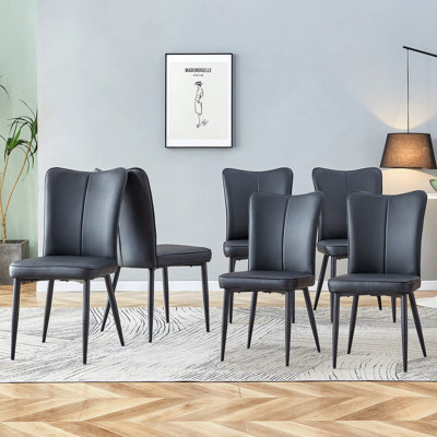 Ensemble de chaises de salle à manger modernes en polyuréthane avec dossier ergonomique et surface facile à nettoyer pour la cuisine ou le salon.