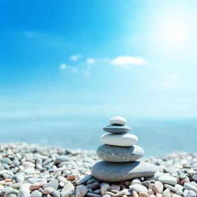 zen-like stones on beach by mycola - Wrapped Canvas Square Print