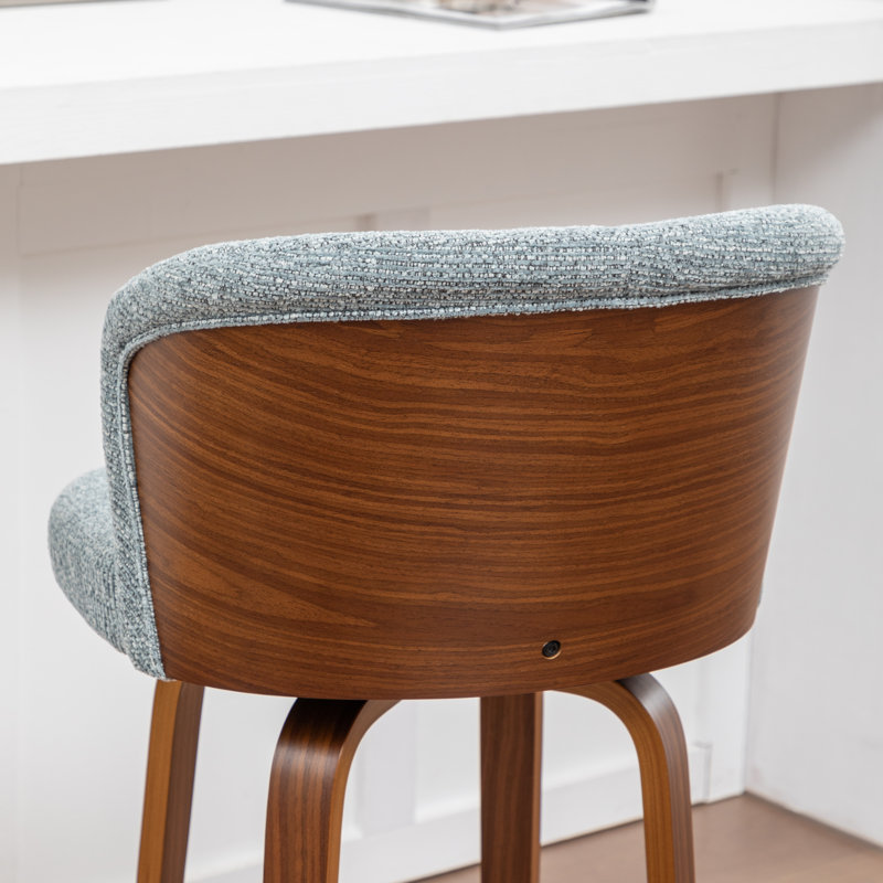 Tabouret de comptoir pivotant rembourré avec structure en bois Devaney, Bleu