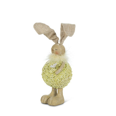 Figurine de lapin portant des fleurs debout