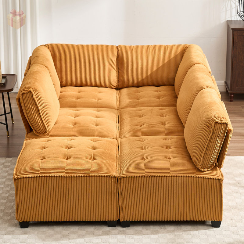 Luxueux canapé modulaire en velours côtelé avec assise profonde et conception adaptable, parfait pour les espaces de vie modernes et élégants.