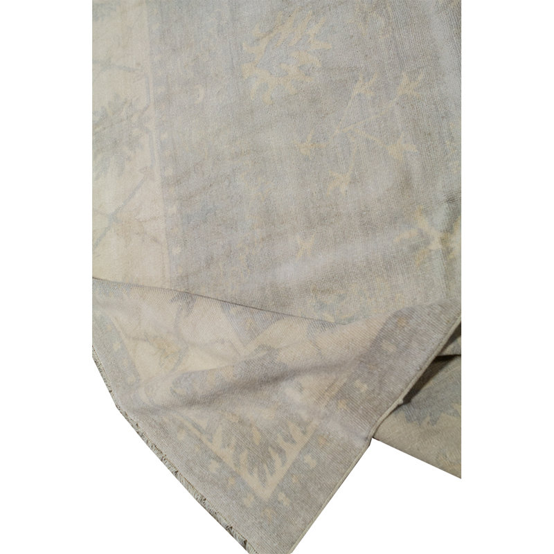Tapis bleu et ivoire de haute qualité noué à la main