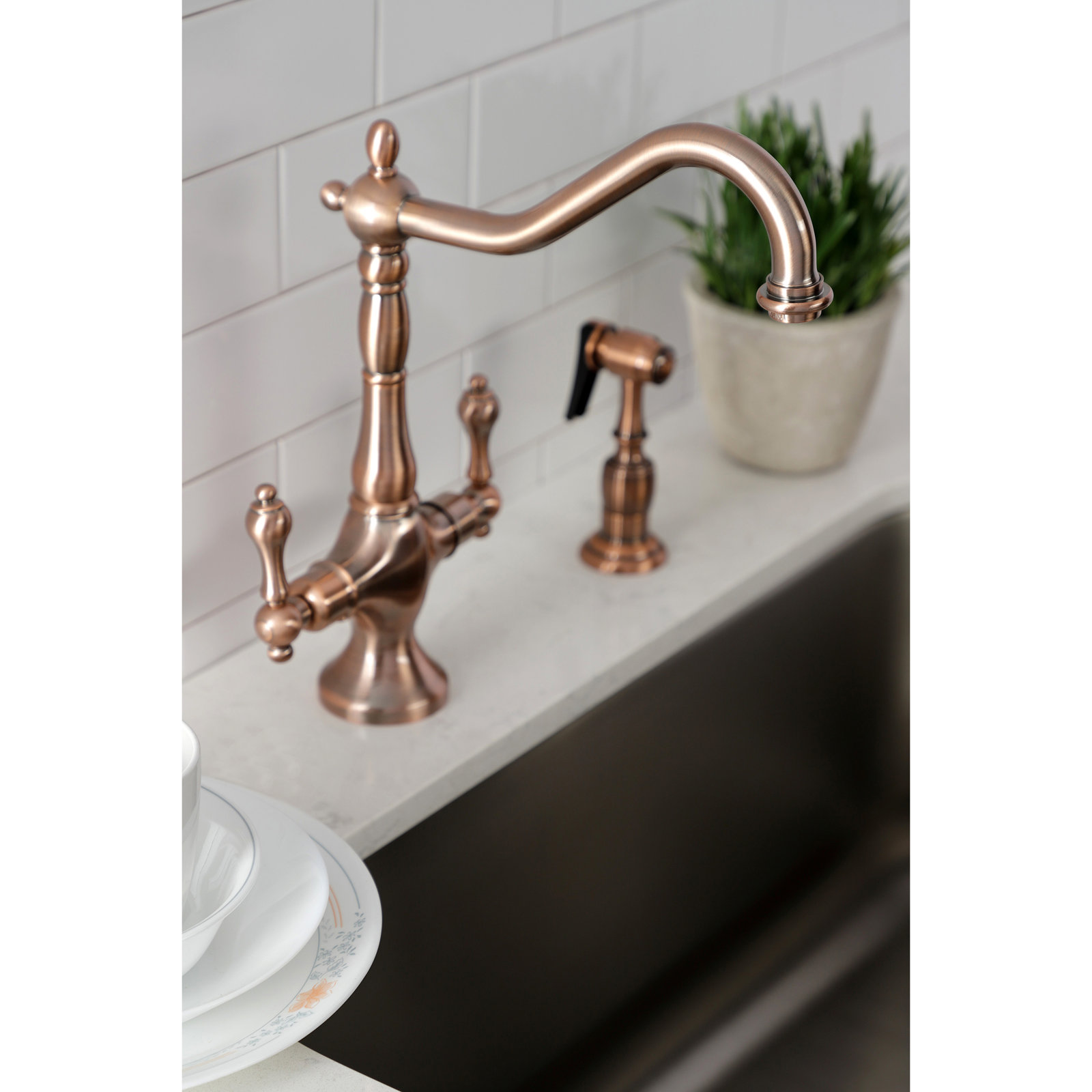 Kingston Brass Heritage Two-Handle Deck Mount Kitchen Faucet, With Spray, Antique Copper