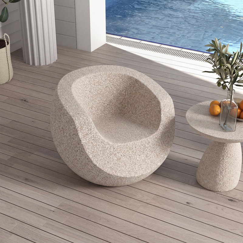 Chaise longue d'extérieur sculpturale, finition pierre artificielle, ergonomique