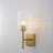 Dimmable Armed Sconce with Prismatic Glass Shade