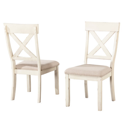 Chaises de salle à manger antiques en blanc à dossier croisé de 2 personnes. Structure en bois d'hévéa massif. Coussin de siège brun clair, bordure à passepoil. L 18,68 po x P 23,5 po x H 39,64 po, H 15,7 po x 2 po. Revêtement. Fabrication. Hauteur