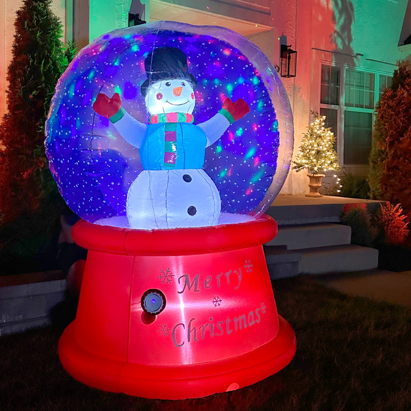  6 pi. Grand globe de neige enneigé multicolore avec musique