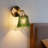 Vintage Green Carved Glass Wall Sconce With Brass Finish – Warm Ambient Bedside Lamp