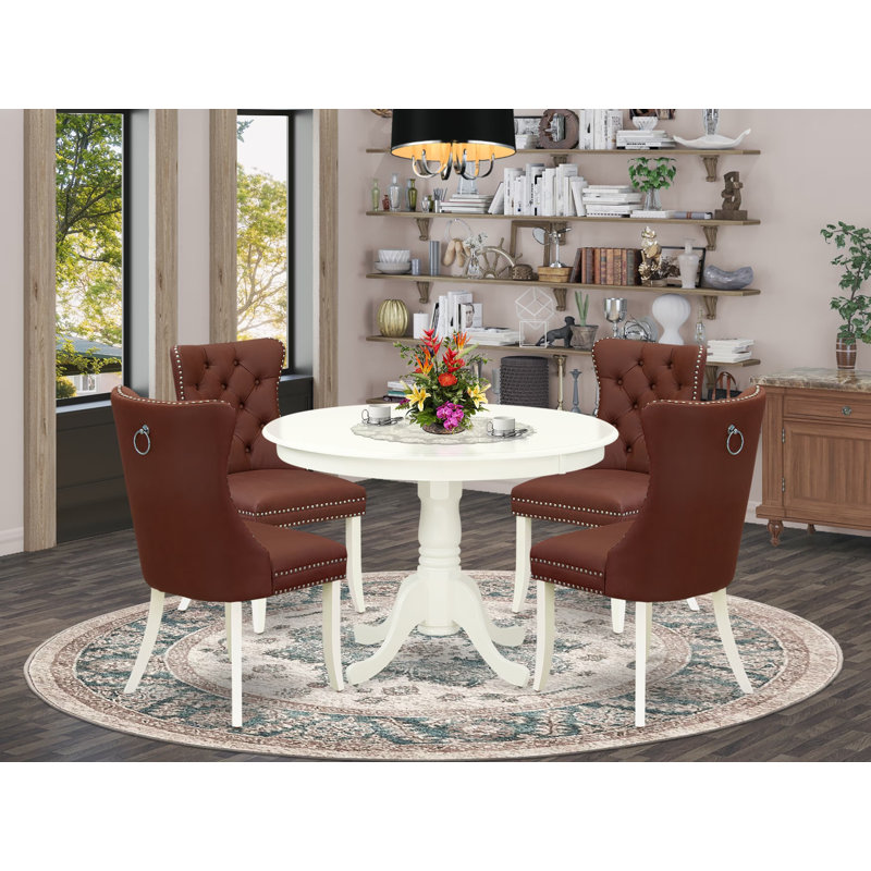 Cet ensemble de 5 pièces comprend une table de salle à manger ronde avec piédestal et 4 chaises rembourrées Parson