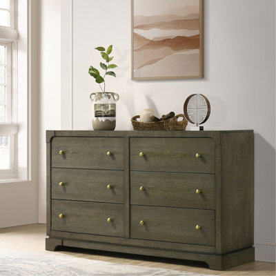 Dresser&Chest with a rustic wood finish and knob accents combines vintage charm with spacious bedroom storage