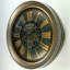 Horloge murale avec engrenages en mouvement de The Horloge