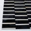 Tapis rayé en cuir fait à la main noir / beige Speaks-196497635
