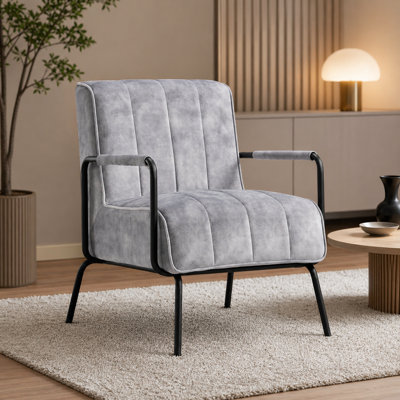 Fauteuil capitonné Monika