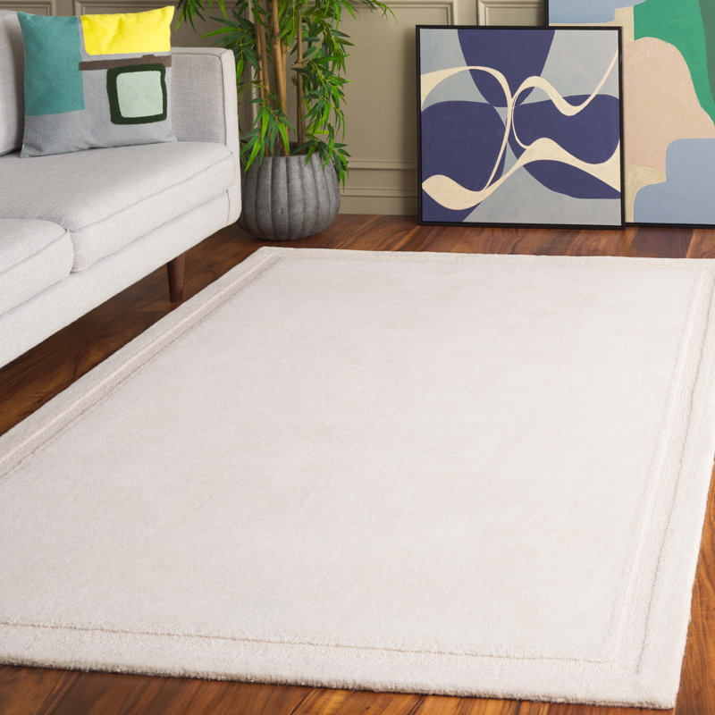 Sopheia Hand Tufted Wool Cotton Solid Color Rug in Ivory, Rectangle 5' x 8'