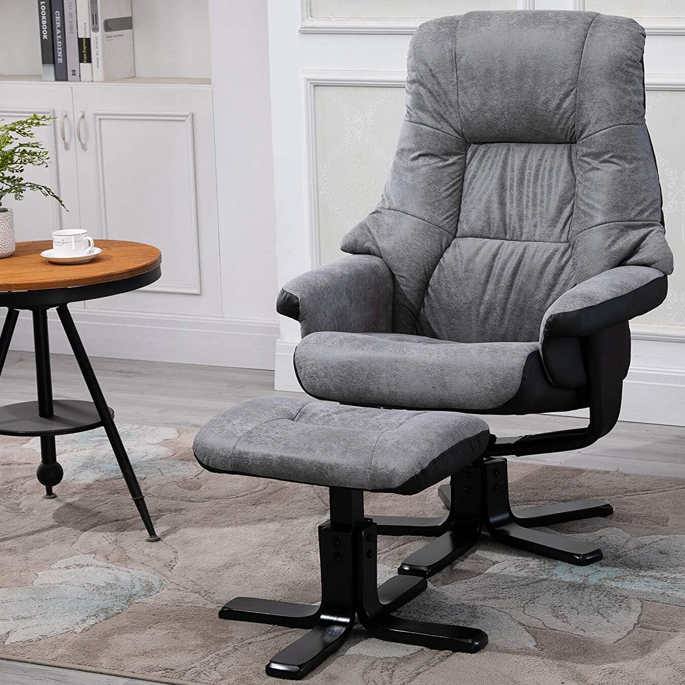 Manual swivel recliner with outlet footstool