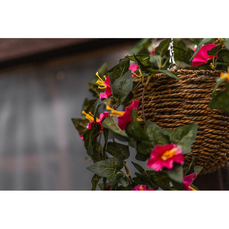 15cm Faux Flowering Plant in Wicker/Rattan Basket