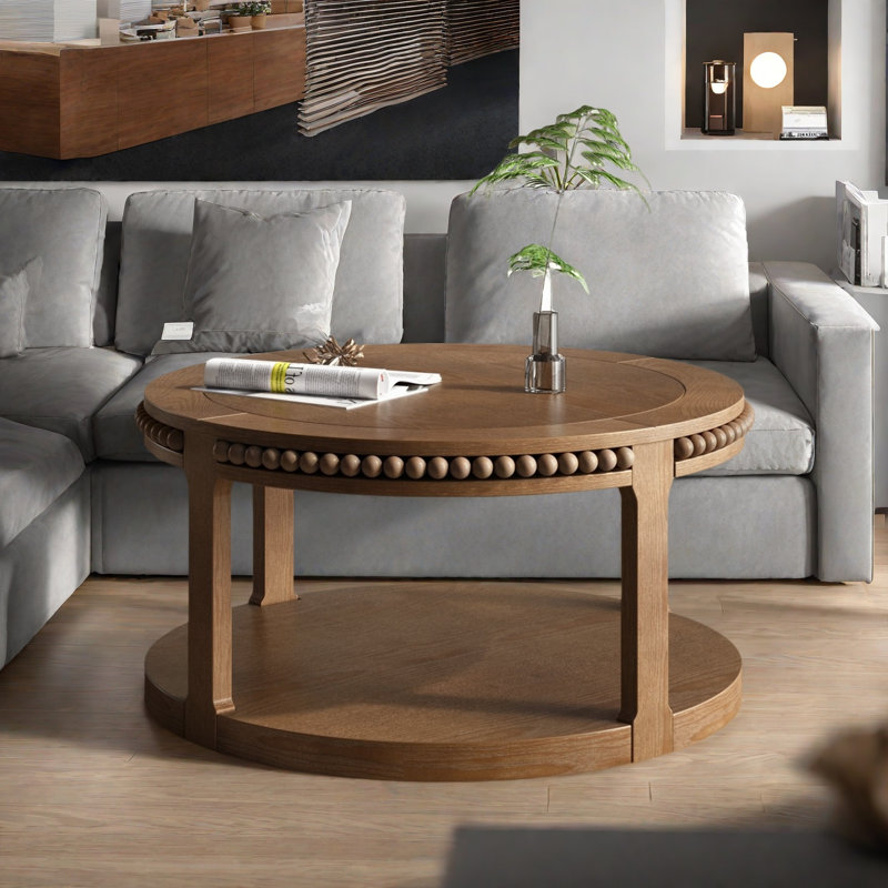 Table basse ronde avec plateau épaissi à deux niveaux, pieds robustes et motif perlé, Noyer