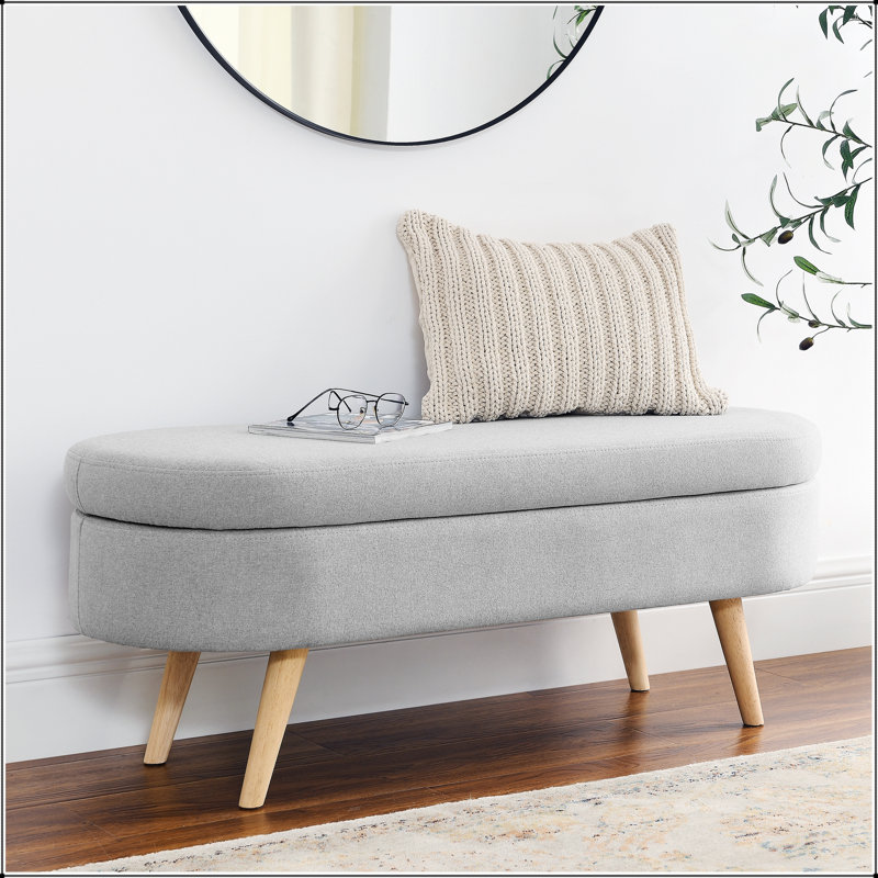Banc de rangement ovale avec pieds en bois d'hévéa, tissu plissé élégant et intérieur spacieux pour les maisons modernes