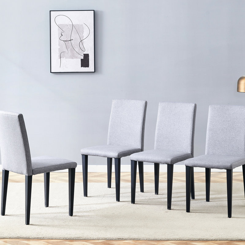4 chaises de salle à manger grises - confortables et tendance. Conception minimaliste pour une vie moderne. Convient aux tailles appropriées. Pieds en métal avec surface lisse. Naturel respirant. Fabrication stable intégrée.